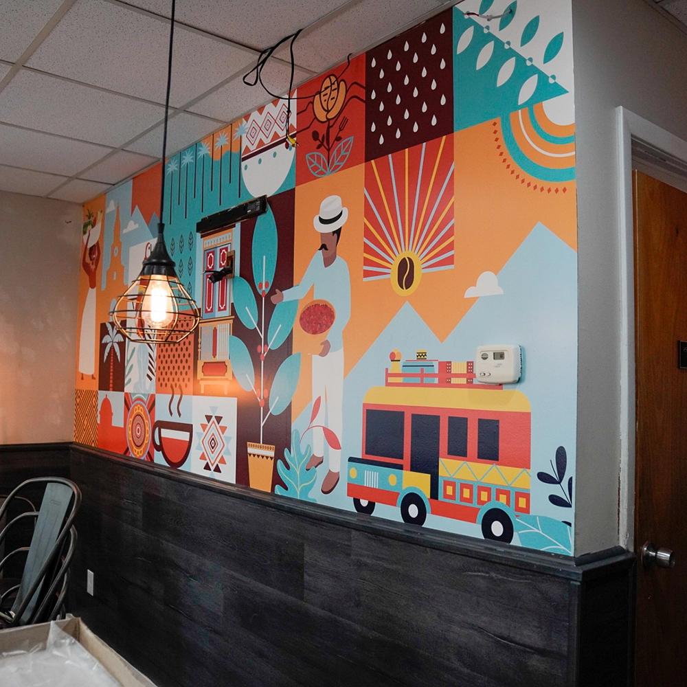 A vibrant restaurant interior featuring colorful murals adorning the walls, creating a lively atmosphere. Mera Wala Print. Merawalaprint.